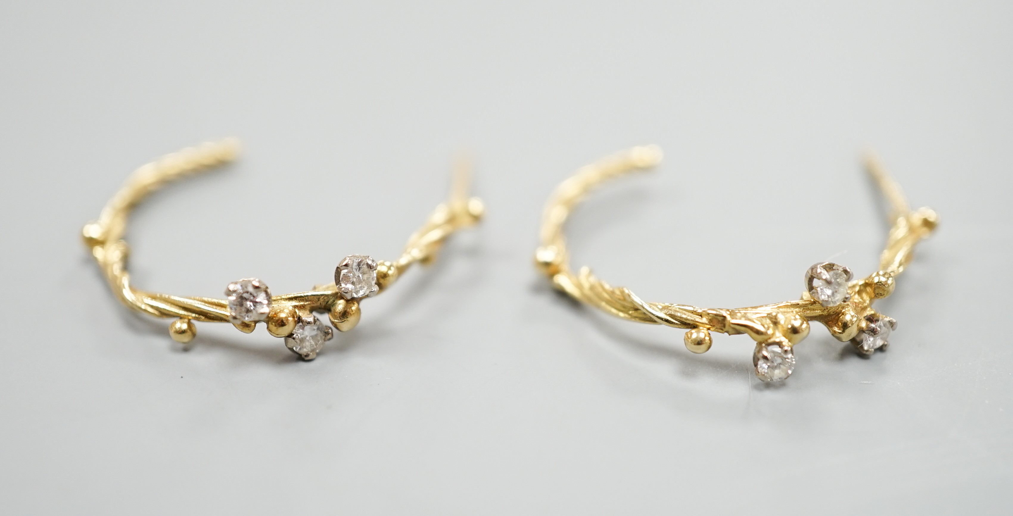 A pair of 18ct gold and three stone diamond set rustic hoop earrings, no butterflies, 25mm, gross weight 3.5 grams.